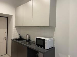 Кухня или кухненски бокс в VIP Apartment Ploscha Rynok