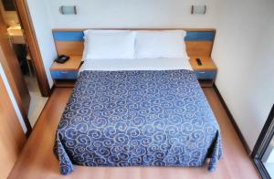 Postel nebo postele na pokoji v ubytování Hotel Fenix