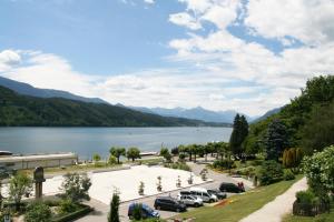 a view of a parking lot next to a lake at Pension Pleikner in Millstatt
