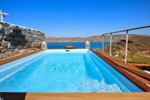 a pool on a house with a view of the ocean at Villa Princess 6 private with Pool Panormos Beach in Panormos Mykonos