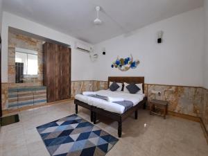 Postel nebo postele na pokoji v ubytování 4 BHK Private Villa Near Calangute