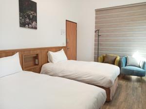 Postel nebo postele na pokoji v ubytování Lukang Inn