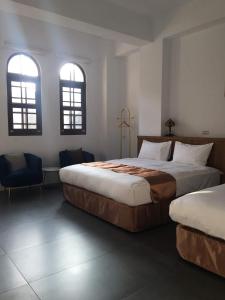Postel nebo postele na pokoji v ubytování Lukang Inn
