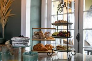 a display of different types of bread and pastries at Casa Portuguesa - Charming House in Ponta Delgada
