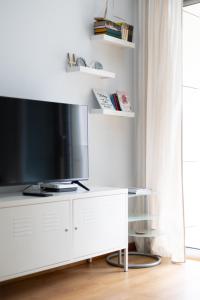 TV o dispositivi per l'intrattenimento presso FiveStepsToSea - Beach Apartment Valencia