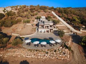 an aerial view of a house with a swimming pool at Borgo Thassos in Astris