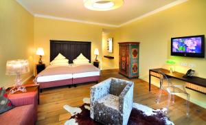 Telewizja i/lub zestaw kina domowego w obiekcie Hotel Alpine Palace