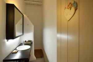 a bathroom with a sink and a mirror at Villa Princess 5 4Bed with Jacuzzi Panormos Beach in Panormos Mykonos