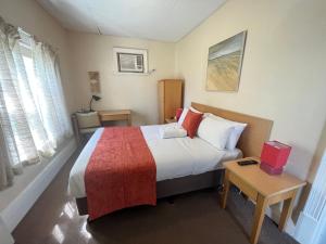 Postel nebo postele na pokoji v ubytování Princes Lodge Motel