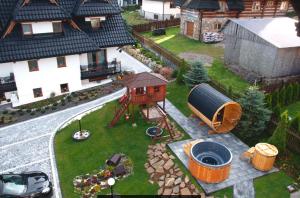 Vonkajšia záhrada v ubytovaní Apartamenty Dwupoziomowe Na Dwa Widoki z Jacuzzi & Sauna