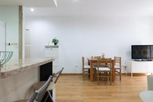 TV o dispositivi per l'intrattenimento presso FiveStepsToSea - Beach Apartment Valencia