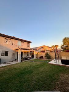 a house with a lawn in front of it at Cozy Private room with Shared bathroom Inside a house in Phoenix