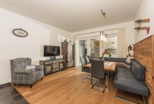 Televízia a/alebo spoločenská miestnosť v ubytovaní Appartement Gabbie by Schladming-Appartements