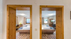 Posteľ alebo postele v izbe v ubytovaní Appartements Am Burgsee