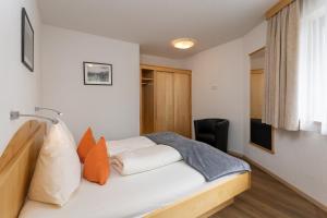 Posteľ alebo postele v izbe v ubytovaní Appartements Am Burgsee
