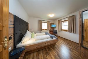 Posteľ alebo postele v izbe v ubytovaní Appartements Am Burgsee