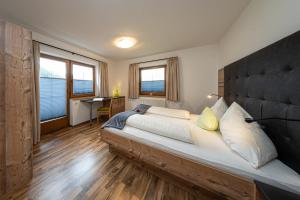 Posteľ alebo postele v izbe v ubytovaní Appartements Am Burgsee