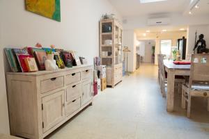 a room with a table and some wooden chests at The White Knight Premium Boutique Hotel in Għajnsielem