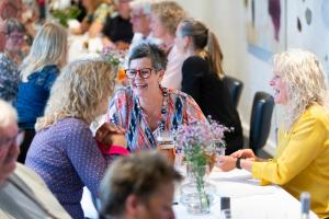 a group of people sitting at a table together at Dolphin Hotel Herning in Herning