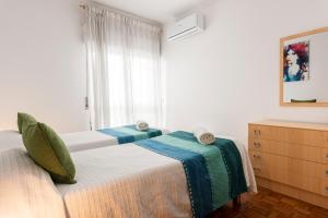 Postel nebo postele na pokoji v ubytování OLIVE - Quarteira