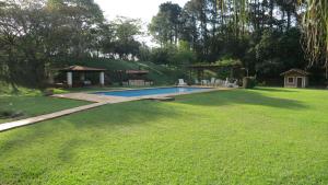 Bazén v ubytování Recanto Primavera - casa de campo com 6 suítes nebo v jeho okolí