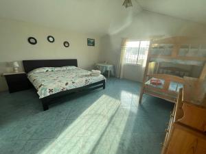 En eller flere senger på et rom på Hostal Cabañas Vistamar