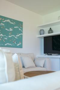 Μια τηλεόραση ή/και κέντρο ψυχαγωγίας στο Vivienda Vacacional Pasito Blanco 1 +62 φωτογραφίες