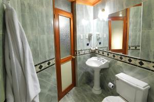 Koupelna v ubytování Hotel El Puma