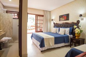 Cama ou camas em um quarto em Terra dos Diamantes Hotel