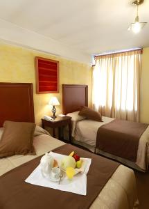Postel nebo postele na pokoji v ubytování Hotel El Puma