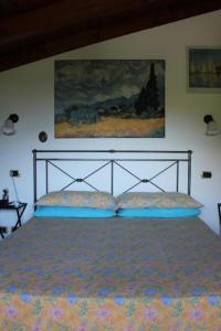 Säng eller sängar i ett rum på Casa Colori (C.I.R. 014051)