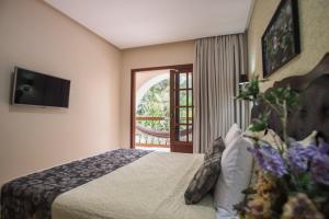 Uma TV ou centro de entretenimento em Terra dos Diamantes Hotel