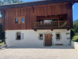 a large house with a balcony and a door at Appartement Samoëns, 3 pièces, 4 personnes - FR-1-624-85 in Samoëns