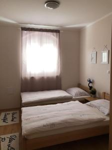 Postel nebo postele na pokoji v ubytování Apartments Dante