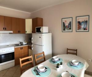 Kuchyň nebo kuchyňský kout v ubytování Apartments Dante