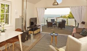 a living room with a view of the ocean at The Bay Colwell in Freshwater