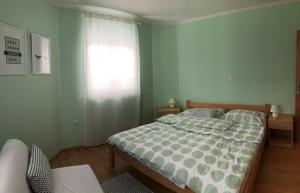 Postel nebo postele na pokoji v ubytování Apartments Dante