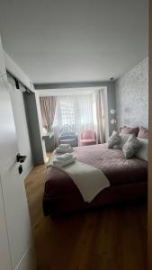 a bedroom with a large bed and a window at Belle Vue Malaga Suite in Málaga