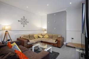 a living room with a couch and a table at Lytham Place in Blackpool