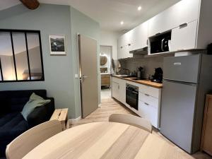 Η κουζίνα ή μικρή κουζίνα στο Appartement central - L'est