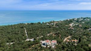 an aerial view of a house on a hill next to the ocean at Gioarde Luxury Villa with Private Pool & Sea Views, by ZanteWize in Akrotiri