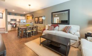 a living room with a couch and a table at Townhome at West Lucaya Resort 3212 in Orlando