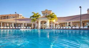 a large swimming pool in front of a hotel at Apartment at Vista Cay Resort in Orlando