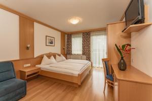 Telewizja i/lub zestaw kina domowego w obiekcie Appartement Lilie by Schladming-Appartements