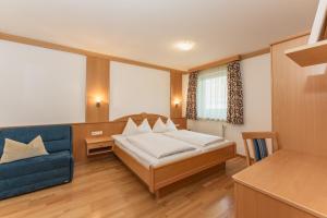 Łóżko lub łóżka w pokoju w obiekcie Appartement Lilie by Schladming-Appartements