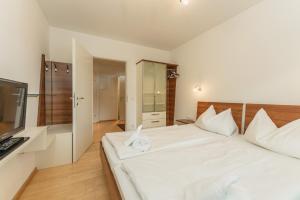 Łóżko lub łóżka w pokoju w obiekcie Appartement Lilie by Schladming-Appartements