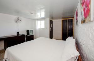 Postel nebo postele na pokoji v ubytování Dios es Fiel - Ali Hotel
