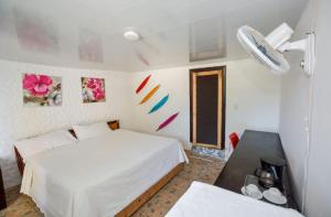 Postel nebo postele na pokoji v ubytování Dios es Fiel - Ali Hotel