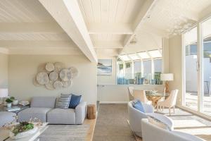 a living room with a couch and chairs at 3911 Point Lobos View home in Carmel