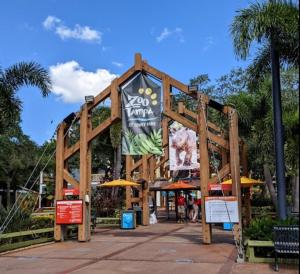 a wooden structure with a sign in a park at Urban Paradise: Stylish Getaway near Buschgardens in Tampa